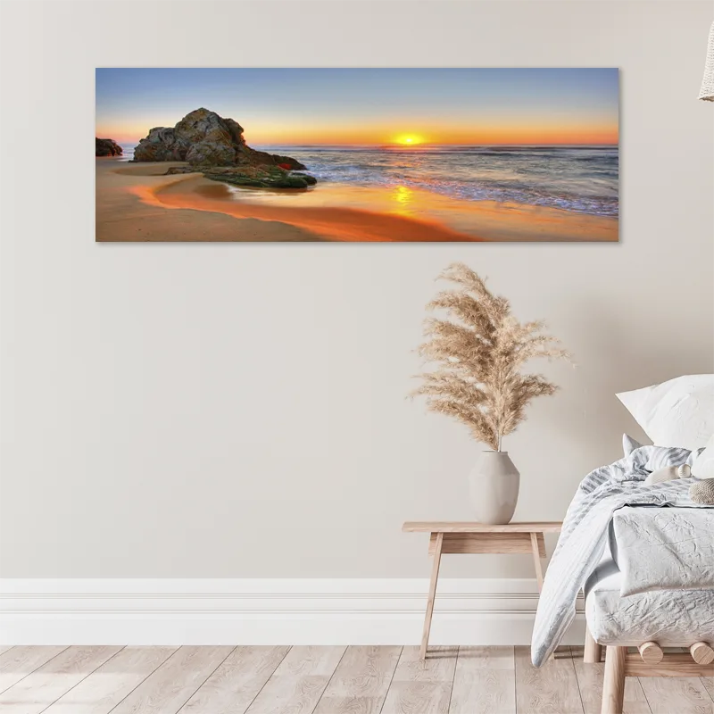 toile déco d'un coucher de soleil sur la mer dans une chambre