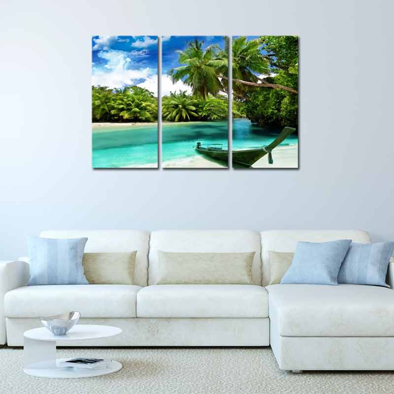Tableau Mural en triptyque d'un Bateau sur la Plage